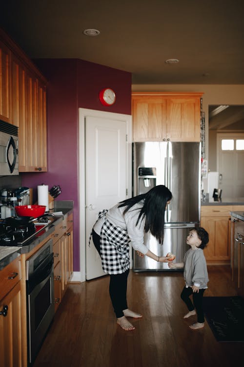 Mother Giving Her Child Food