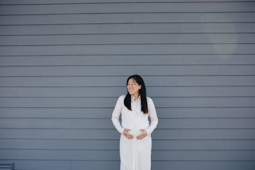 Pregnant Woman Holding Her Tummy