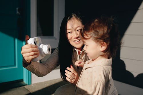 Free Mother Taking Photo Of Her Daughter Stock Photo