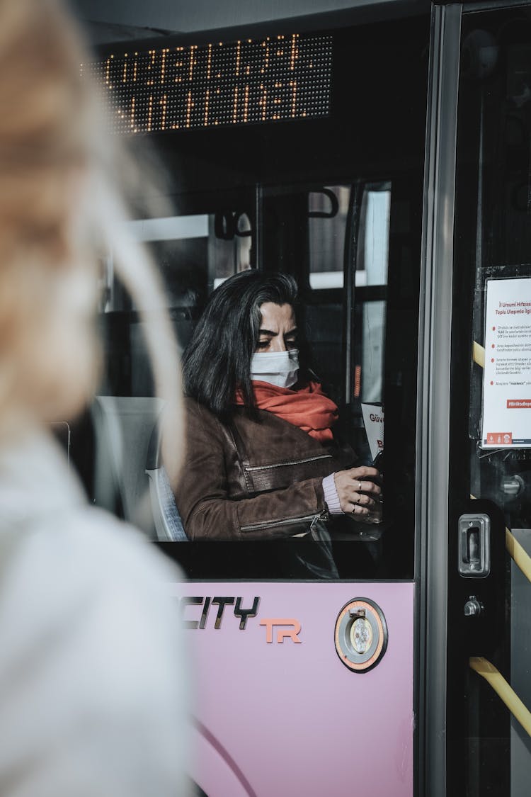 Woman Sitting On Bus