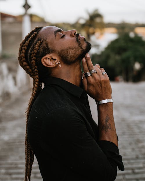 Man in Black Long Sleeve Shirt in Braided Hair