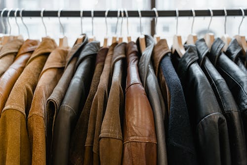 Free Close Up Photo of Clothes Hanging on a Rack Stock Photo