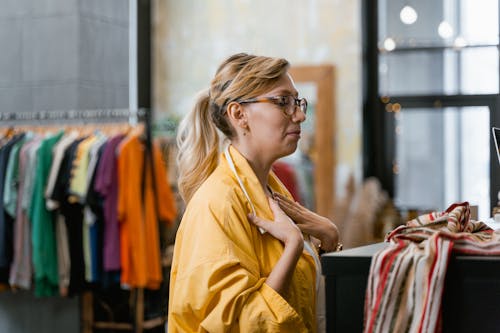 Free A Woman With Eyeglasses Wearing a Yellow Jacket Stock Photo