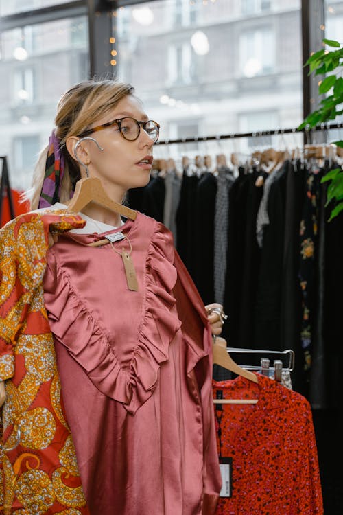 A Woman Shopping Clothes in a Boutique
