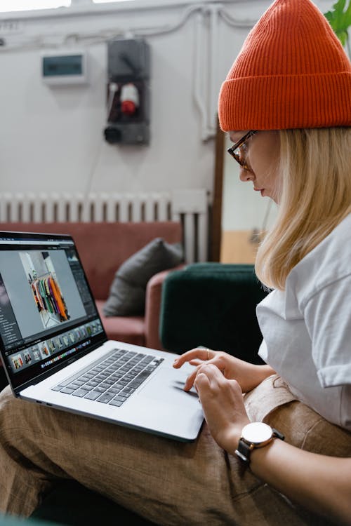 Free Woman in White Shirt Using Laptop Doing Online Shopping Stock Photo