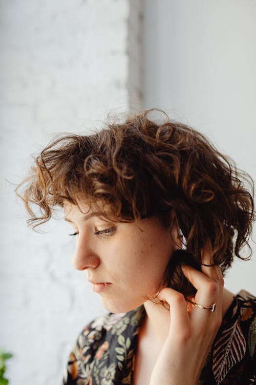 Free A Woman Wearing an Earphone Stock Photo