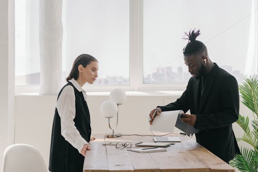 Business professionals collaborating and discussing strategy in a modern office setting.