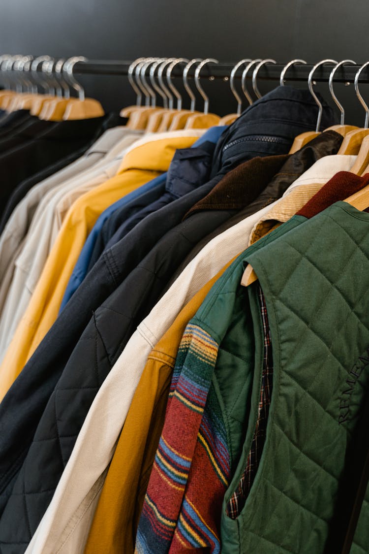 Jackets And Vest Hanging On Clothes Rack 