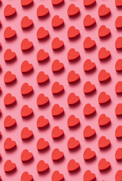 Red Hearts on Pink Background 
