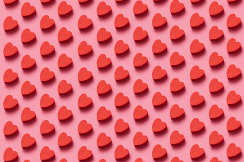 Free Heart Pattern on Pink Background Stock Photo