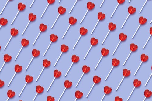  Red Heart Shaped Lollipop on Blue Background 