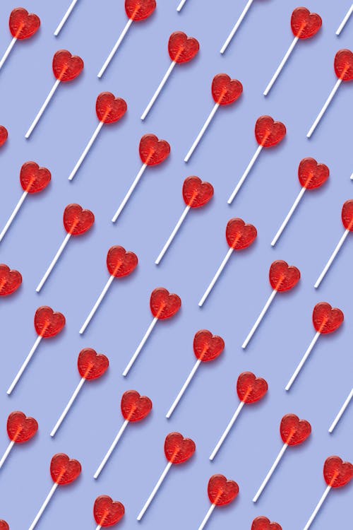 Heart Shaped Lollipop on Blue Background