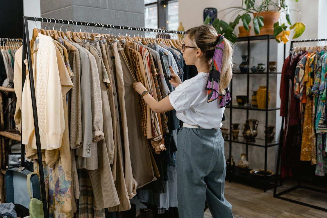 Woman Choosing Clothes in the Shop · Free Stock Photo