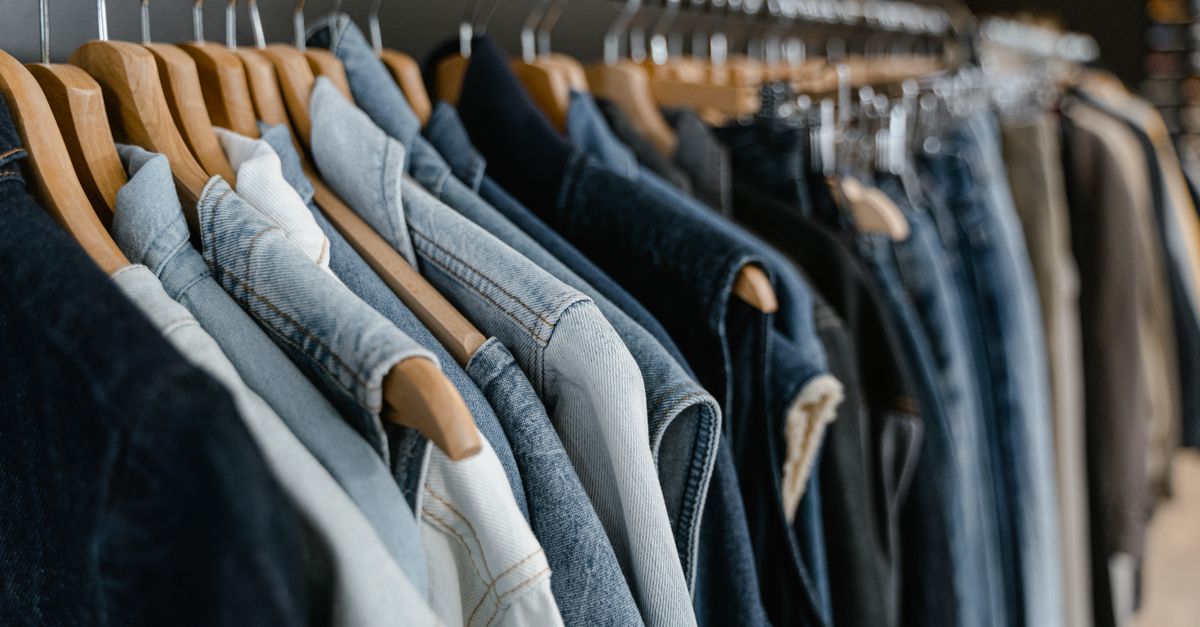 clothes organized by outfit on matching hangers in a closet