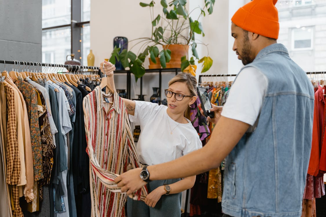 Free Woman Holding Clothing on a Hanger Stock Photo IBM shopping