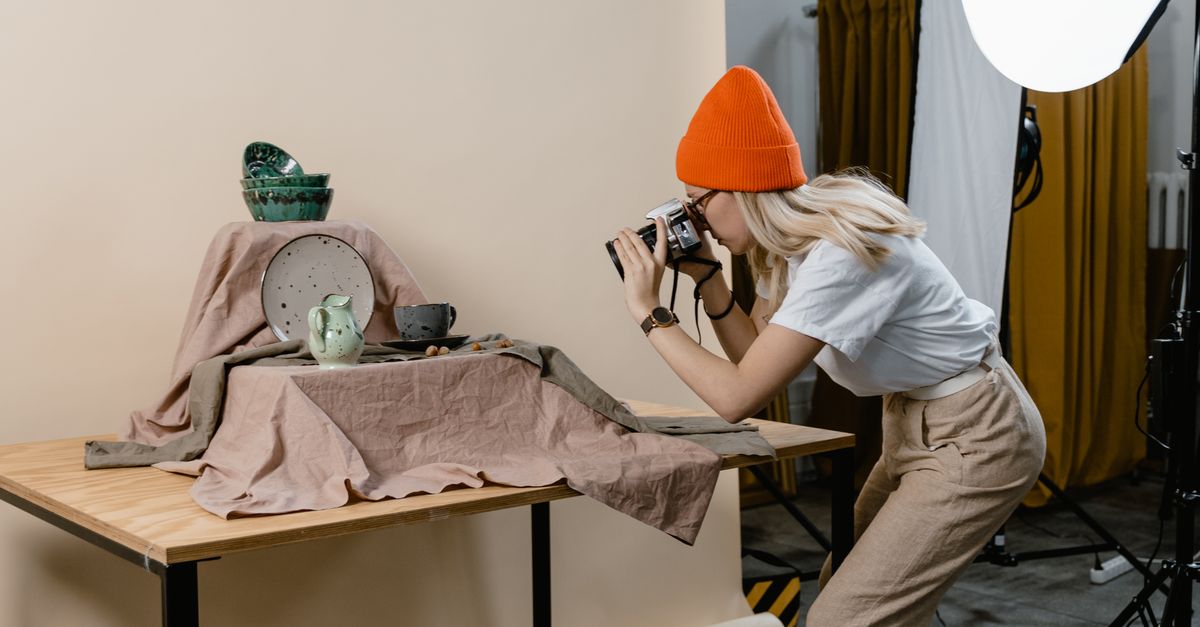 Woman Silverware A Woman Taking Photos of the Silverware on the Table · Free Stock Photo