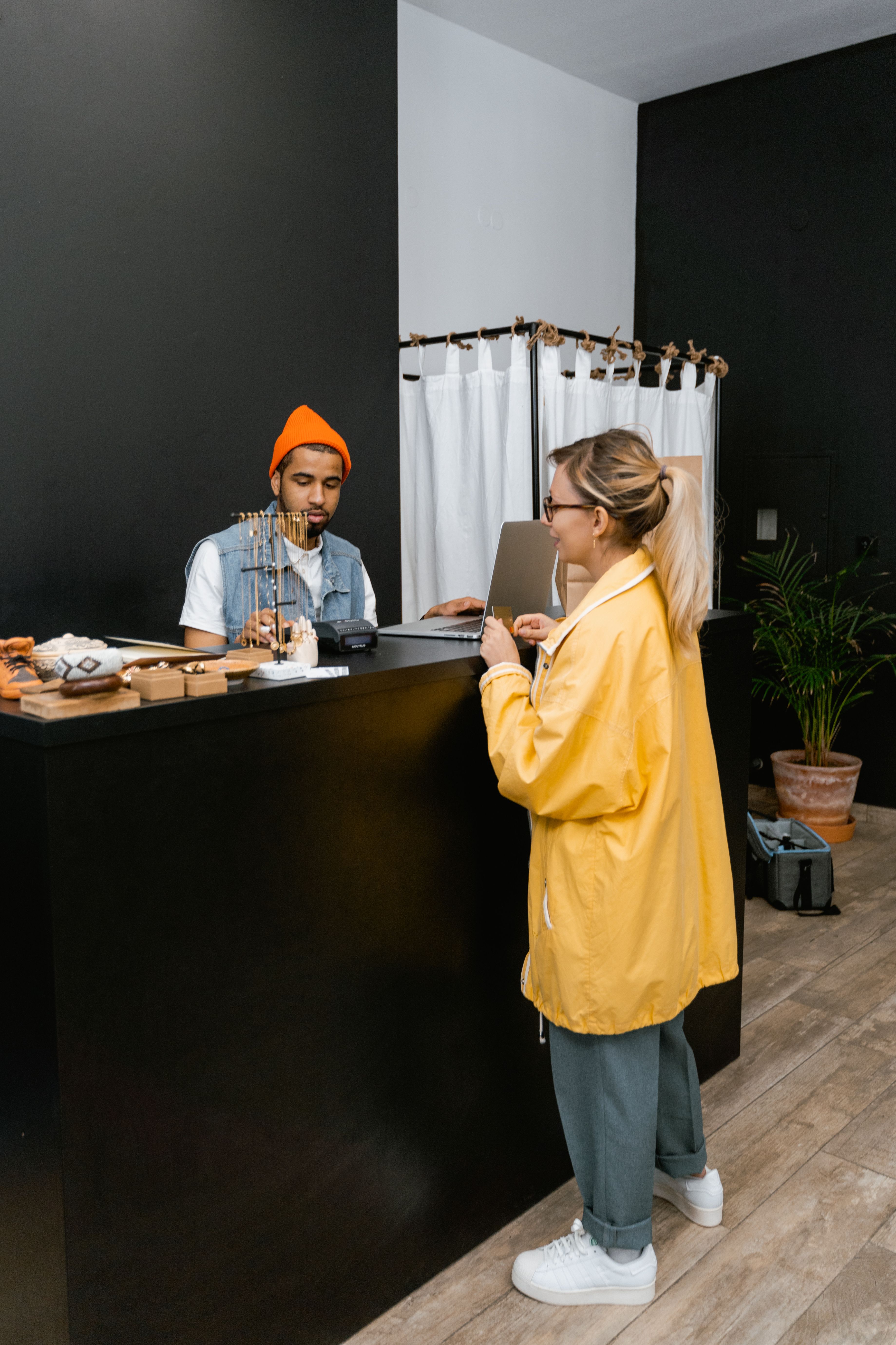 Customer making payment with credit card at diverse retail shop