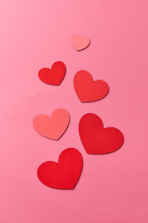 Pink and Red Cutout Hearts on Pink Background