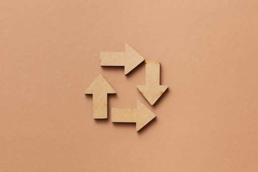 Wooden Arrows on Beige Background