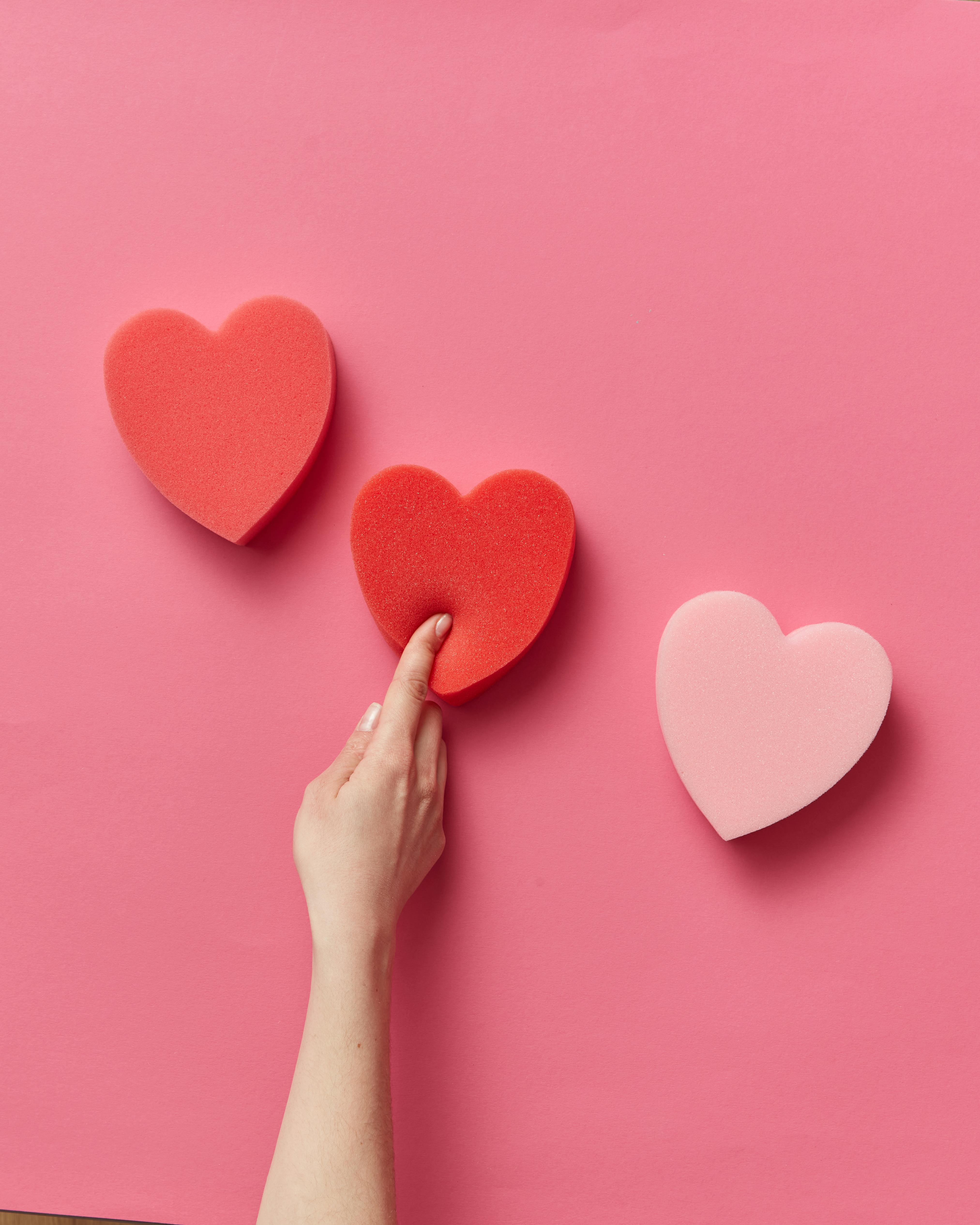 A Purple Heart Shaped Sticky Note Over a Pad of Square Sticky Notes · Free  Stock Photo