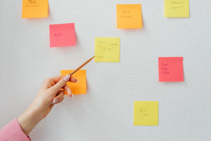 desk with only three sticky notes visible