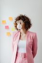 Woman in Pink Blazer Blowing bubble Gum