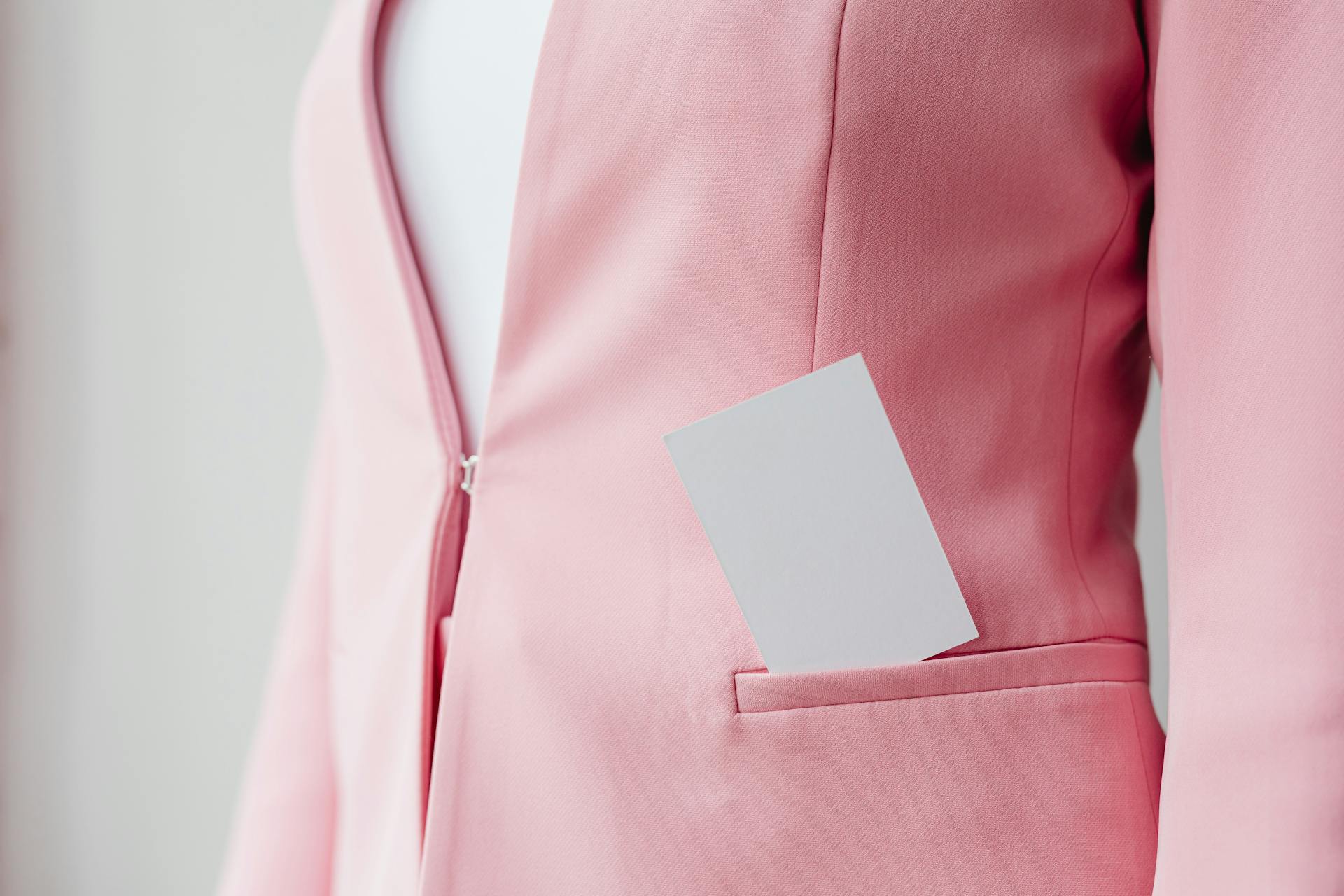 Blank Business Card in Pocket of Pink Blazer