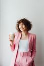 Smiling Woman Holding a Cup of Coffee