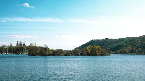 Foto d'estoc gratuïta de aigües tranquil·les, bell cel, blau