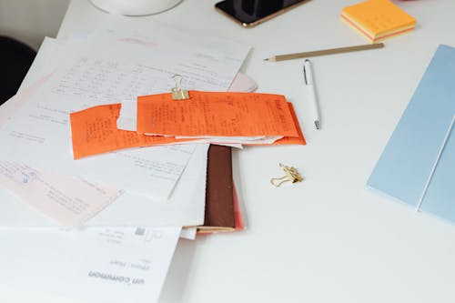 Free Receipts and Documents on Top of a Desk Stock Photo