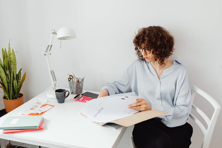 
A Woman Looking At Documents