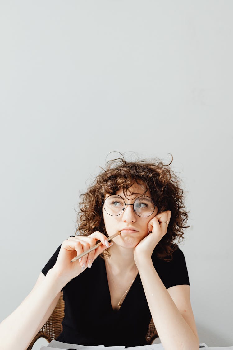 Curly-Haired Woman Wearing Her Eyeglasses