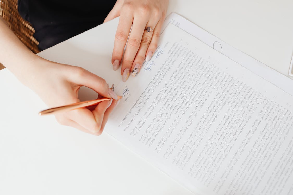 A person signing up documents drawn up by a family lawyer 