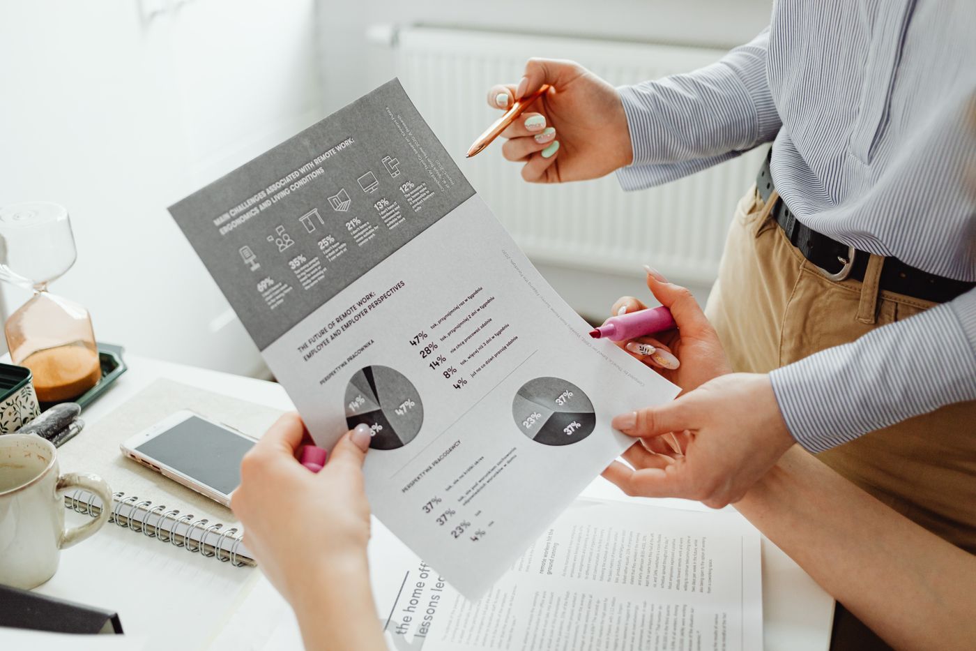 Colleagues reviewing company forecasts and financial charts before year-end