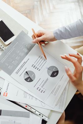 Person reviewing financial documents and bank account paperwork after the death of a loved one