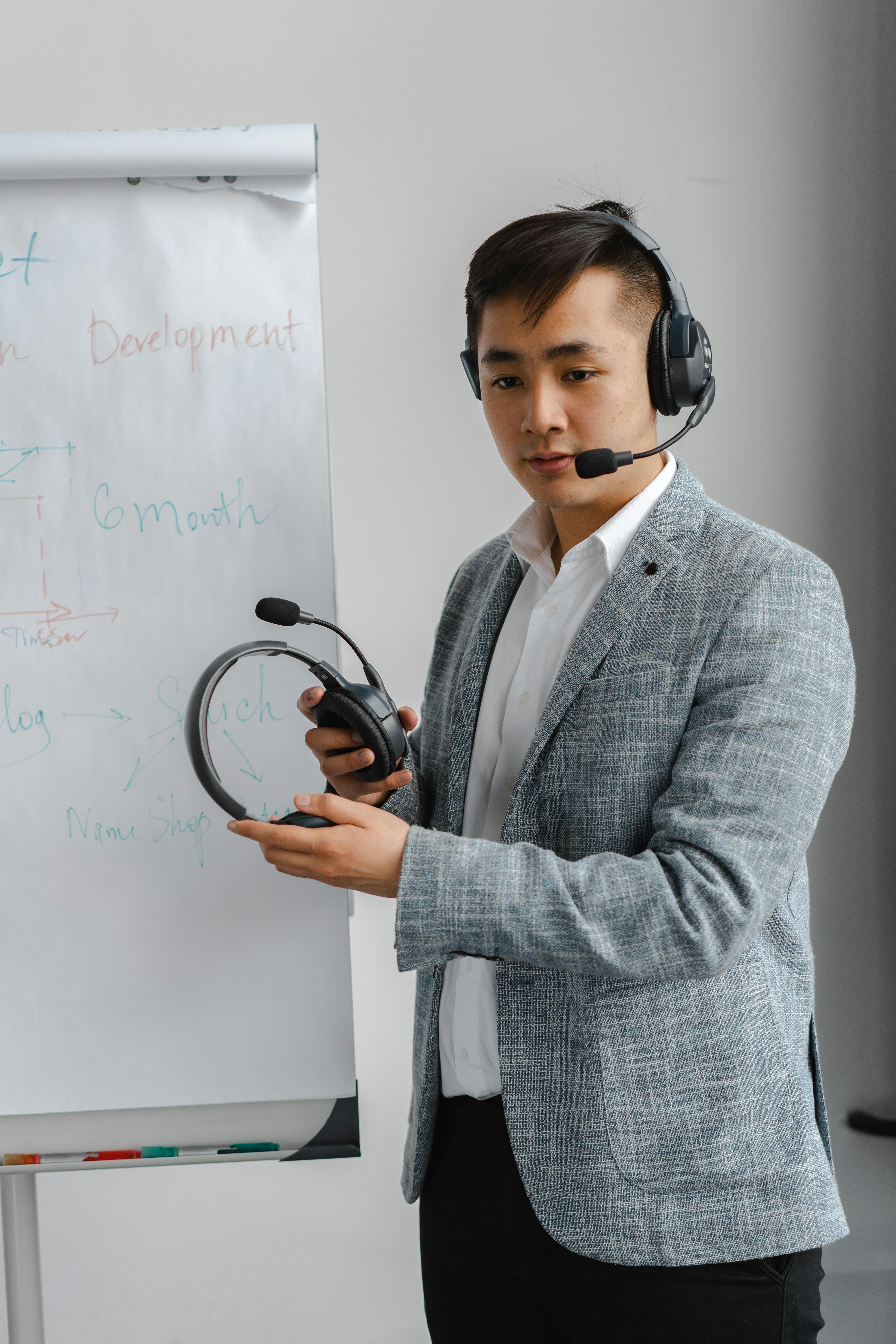 man holding headphones