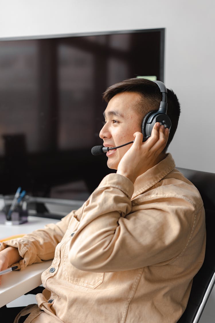 A Call Center Agent Talking On A Headset