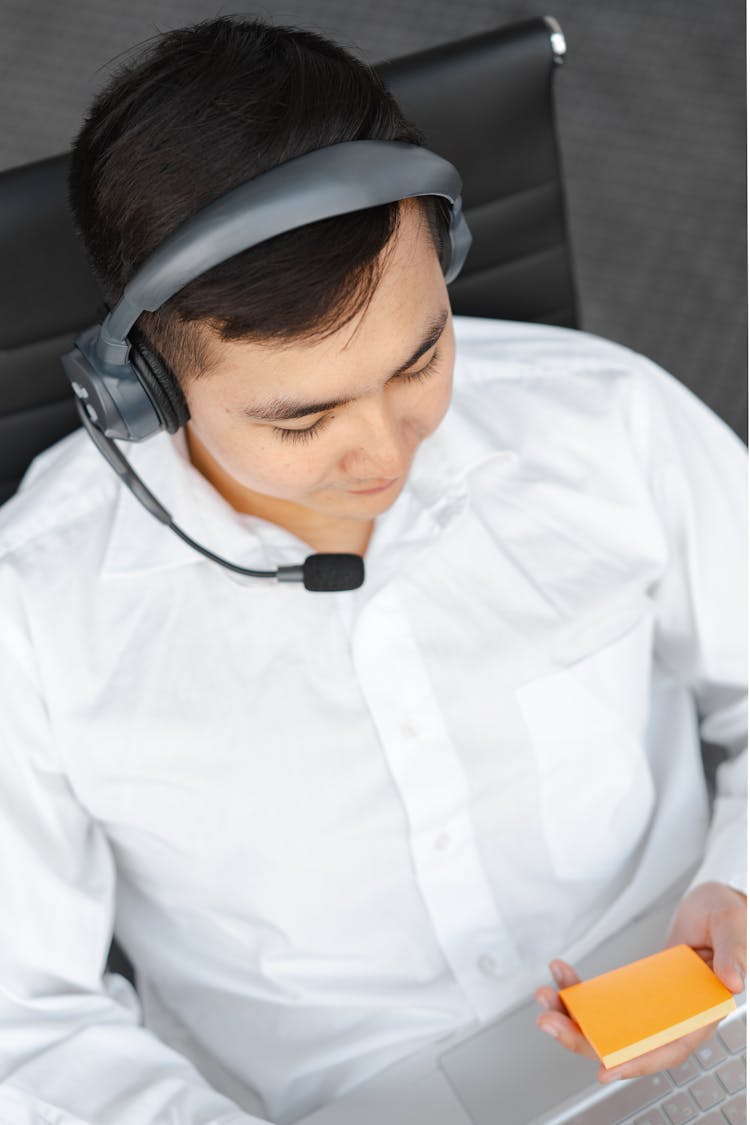 High-Angle Shot Of A Man Wearing His Headphone