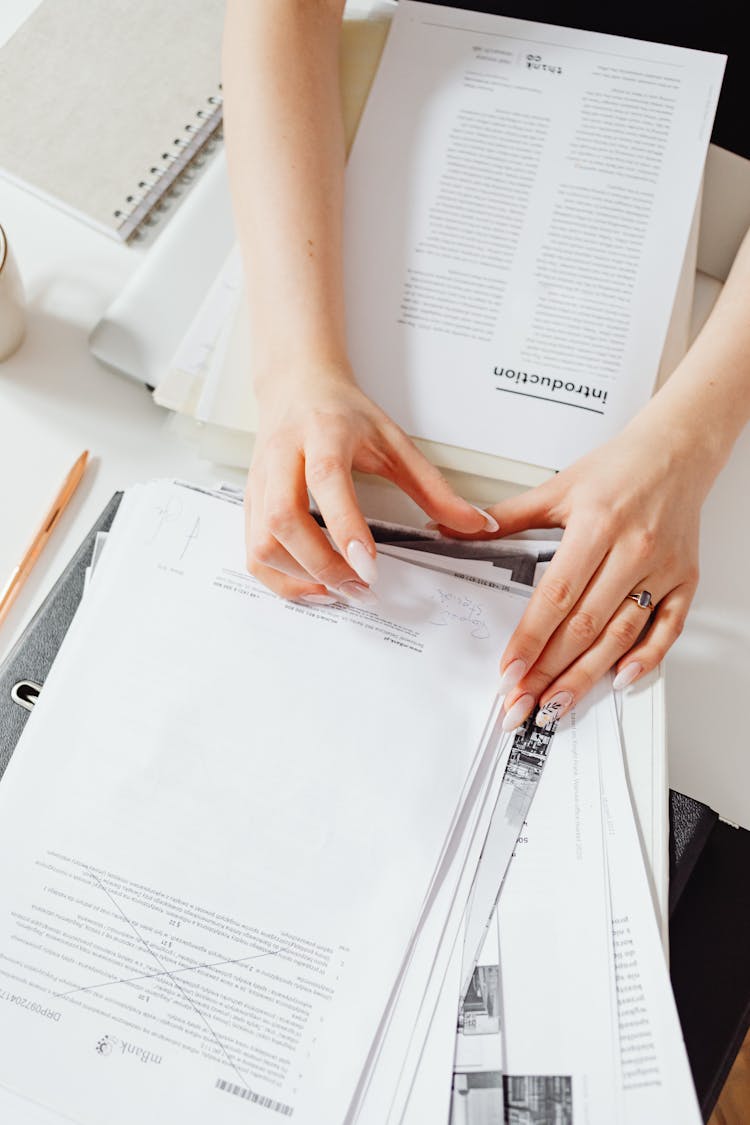 Woman Hands On Documents