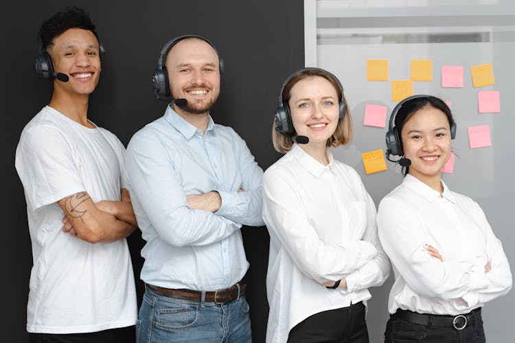 A Group Of People Wearing Headsets