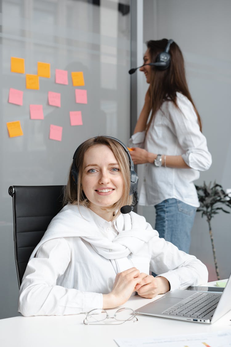 Woman In White Long Sleeve Shirt Working As A Call Center Agent