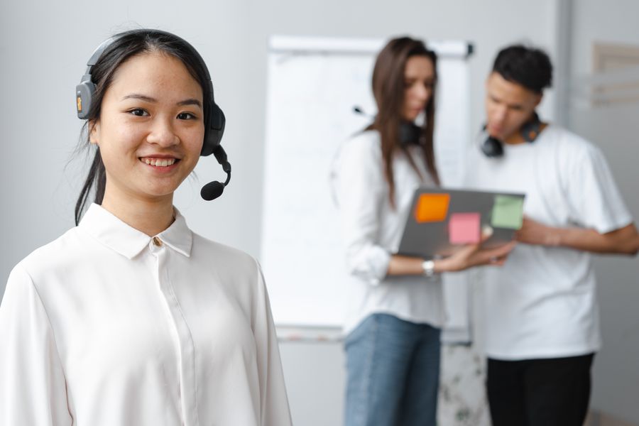 Support specialist wearing a headset, photo by Mikhail Nilov on Pexels