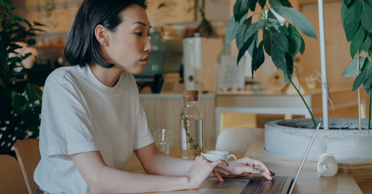 young entrepreneur working laptop coffee shop