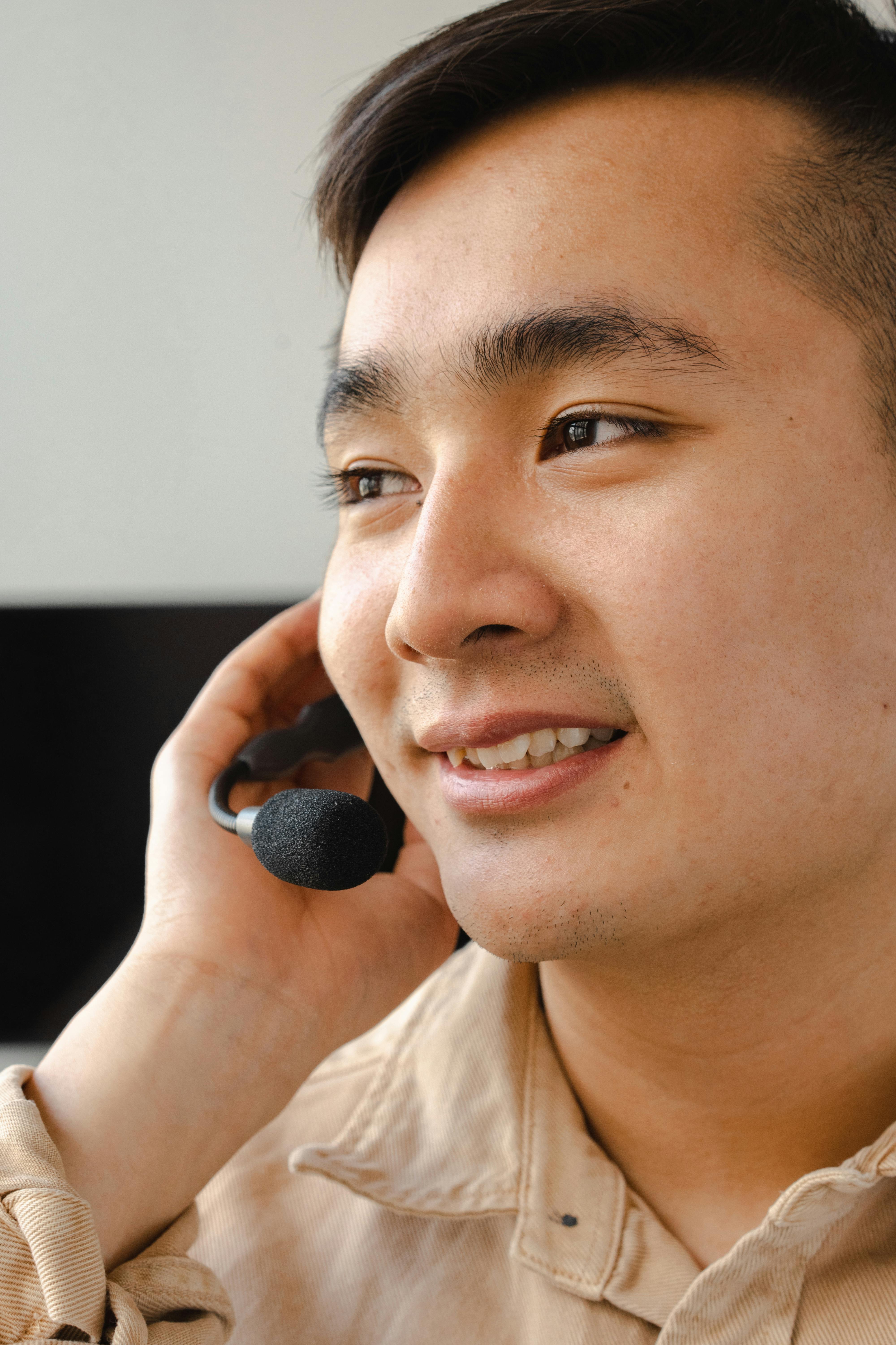 Professional speaking into a headset in an indoor office environment, showcasing communication tools.