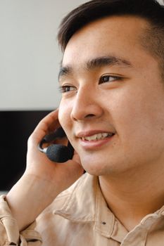 Professional speaking into a headset in an indoor office environment, showcasing communication tools.