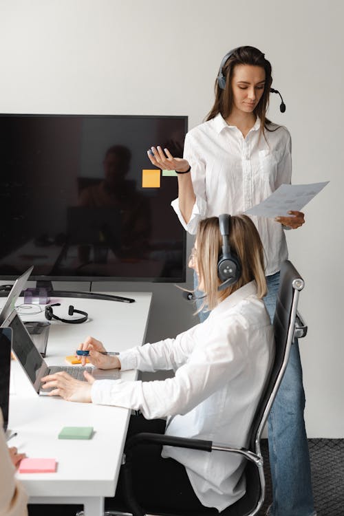 Free Women Working in a Call Center Stock Photo