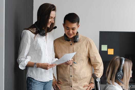 Young professionals working together with headsets in a modern office setting.