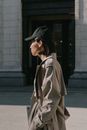 Woman in a Coat Wearing a Black Cap