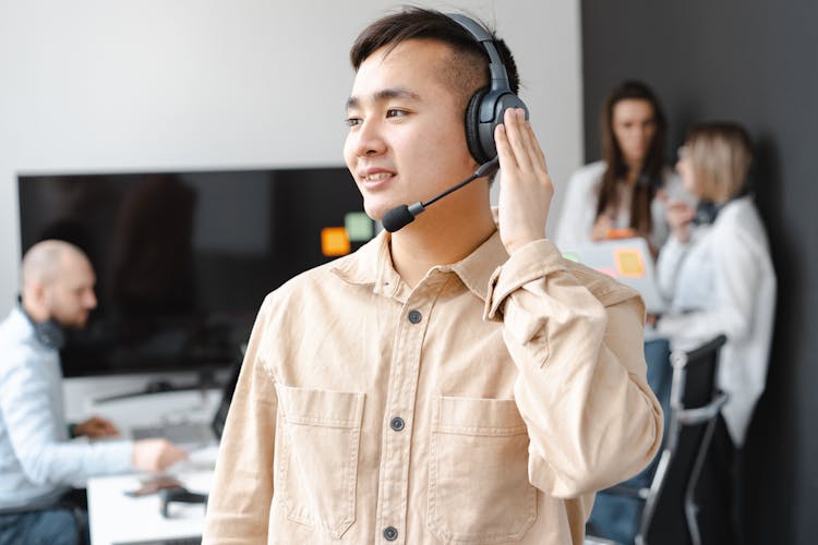 Shallow Focus Of A Man Wearing His Headphone