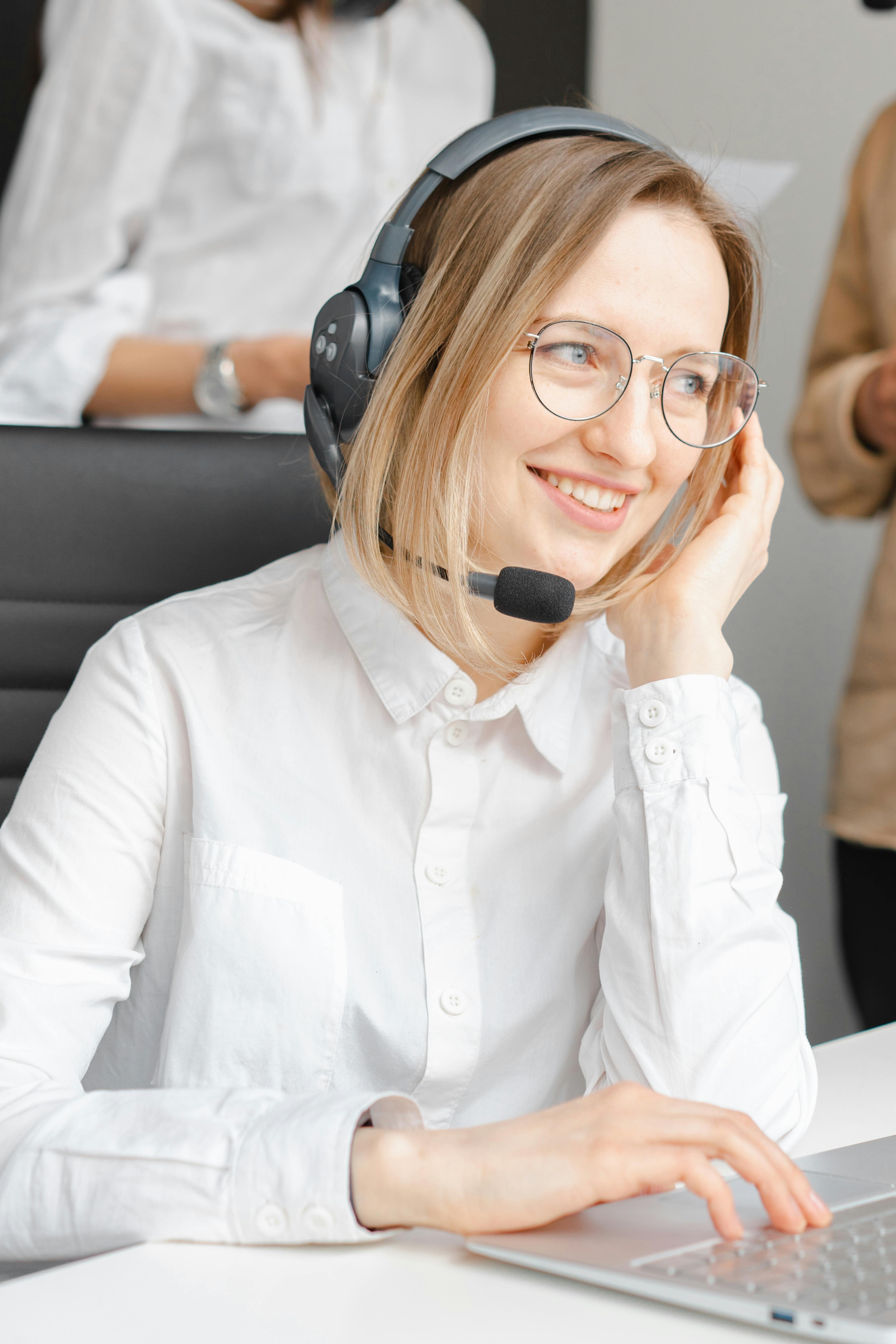 smiling woman working in a call center